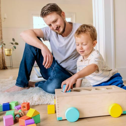 LOVEVERY | The Block Set | Solid Wood Building Blocks and Shapes + Wooden Storage Box, 70 Pieces, 18 Colors, 20+ Activities, Toddler Block Set and Converts into a Pull Car, Ages 12 to 48+ months